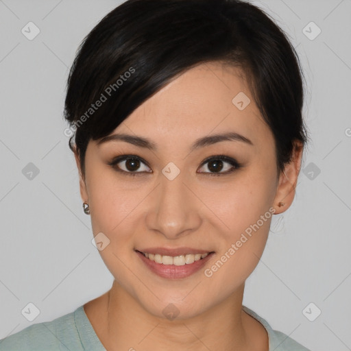 Joyful asian young-adult female with medium  brown hair and brown eyes