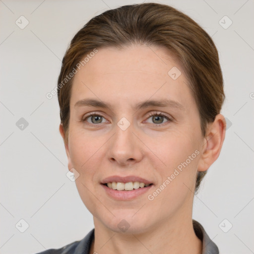 Joyful white young-adult female with short  brown hair and grey eyes