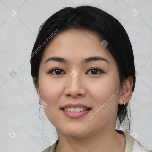 Joyful asian young-adult female with medium  black hair and brown eyes