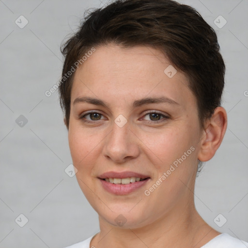 Joyful white young-adult female with short  brown hair and brown eyes