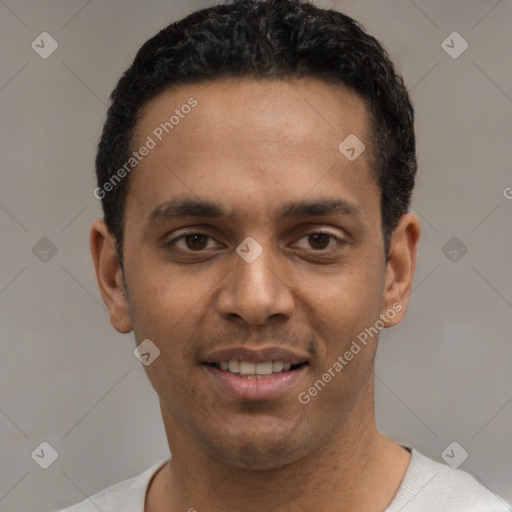 Joyful white young-adult male with short  black hair and brown eyes