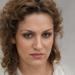 Joyful white young-adult female with medium  brown hair and green eyes