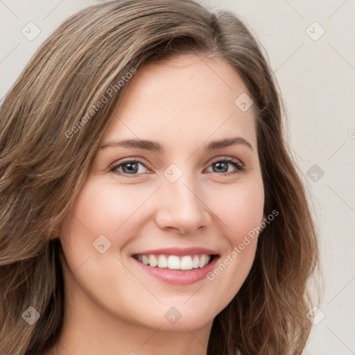 Joyful white young-adult female with long  brown hair and green eyes