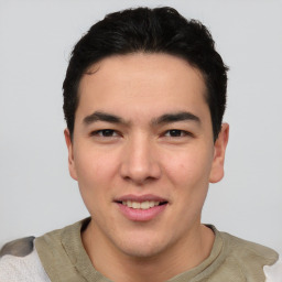 Joyful asian young-adult male with short  black hair and brown eyes