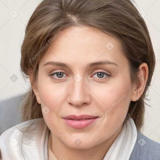 Joyful white young-adult female with medium  brown hair and blue eyes