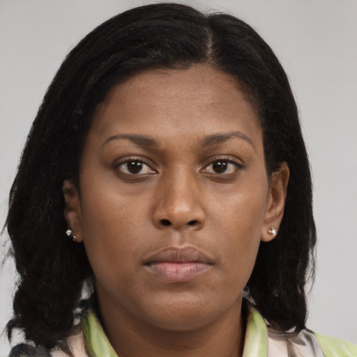 Neutral black young-adult female with long  brown hair and brown eyes