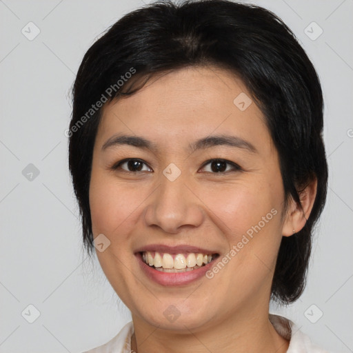 Joyful asian young-adult female with medium  brown hair and brown eyes