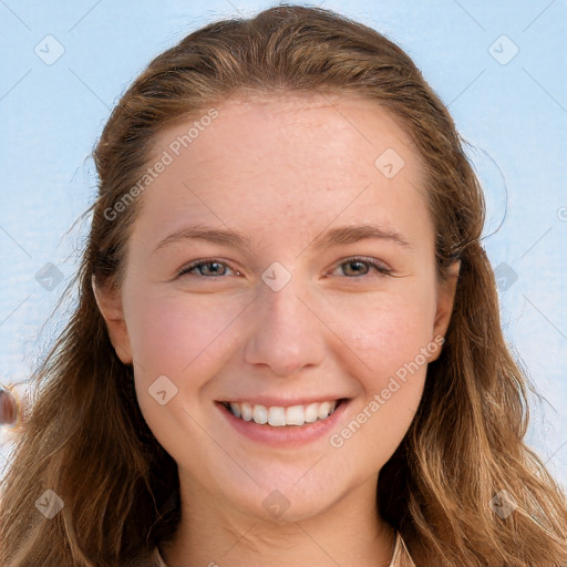 Joyful white young-adult female with long  brown hair and blue eyes