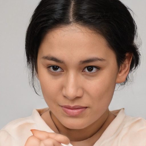 Joyful white young-adult female with medium  brown hair and brown eyes