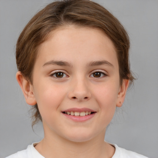 Joyful white child female with medium  brown hair and brown eyes