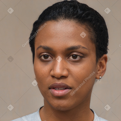 Joyful latino young-adult female with short  black hair and brown eyes