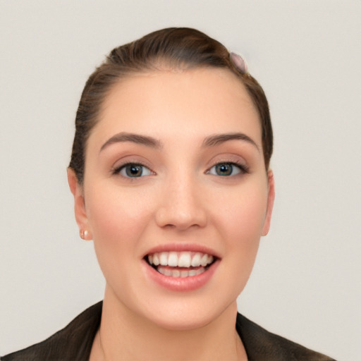 Joyful white young-adult female with long  brown hair and grey eyes