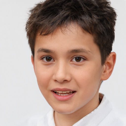 Joyful white child male with short  brown hair and brown eyes