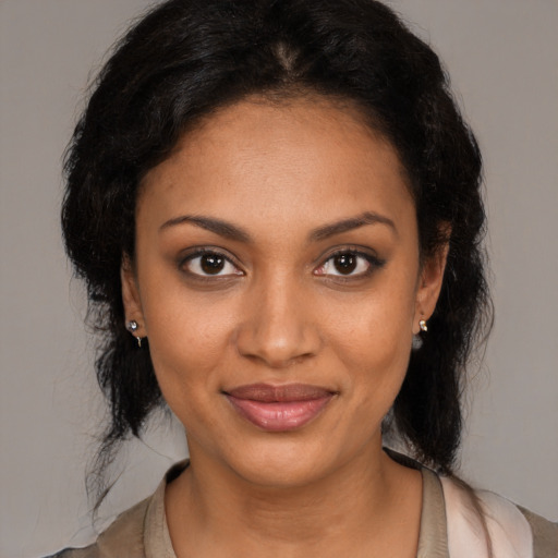 Joyful black young-adult female with medium  black hair and brown eyes