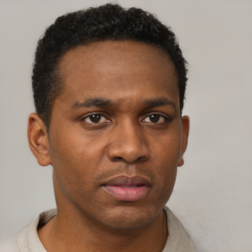 Neutral black young-adult male with short  brown hair and brown eyes