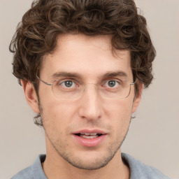 Joyful white adult male with short  brown hair and grey eyes