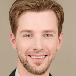 Joyful white young-adult male with short  brown hair and grey eyes