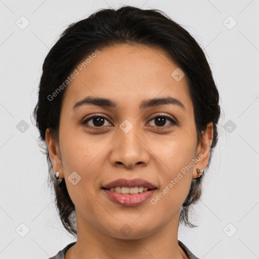 Joyful latino young-adult female with medium  brown hair and brown eyes