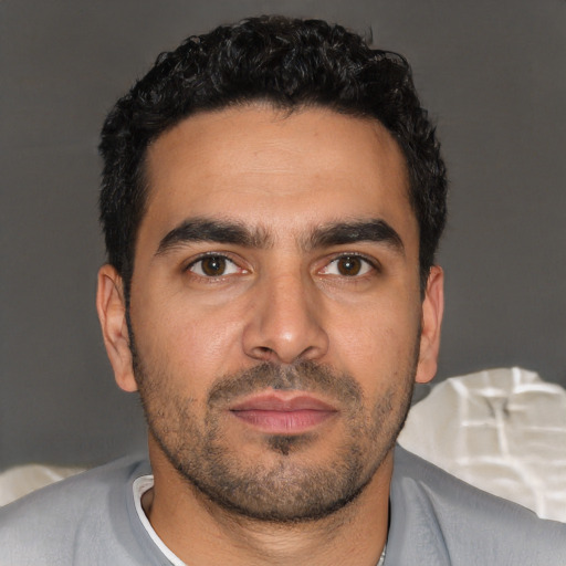 Neutral latino young-adult male with short  brown hair and brown eyes