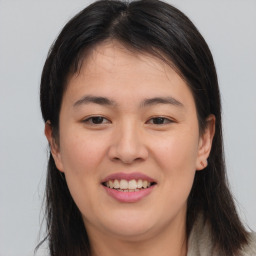 Joyful asian young-adult female with medium  brown hair and brown eyes