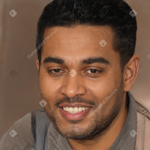 Joyful black young-adult male with short  black hair and brown eyes