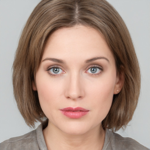 Neutral white young-adult female with medium  brown hair and grey eyes