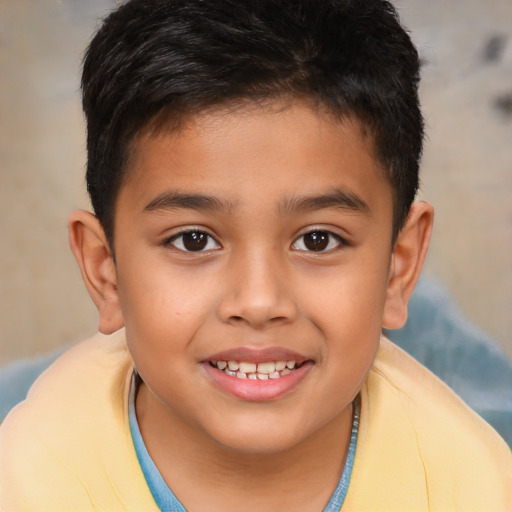 Joyful latino child male with short  brown hair and brown eyes