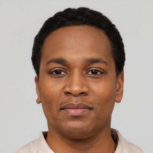Neutral black adult male with short  black hair and brown eyes