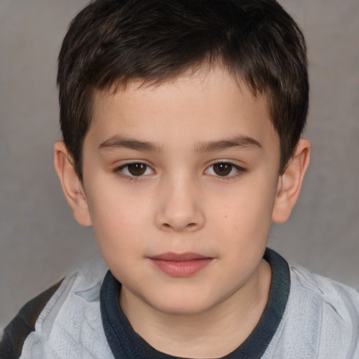 Joyful white child male with short  brown hair and brown eyes