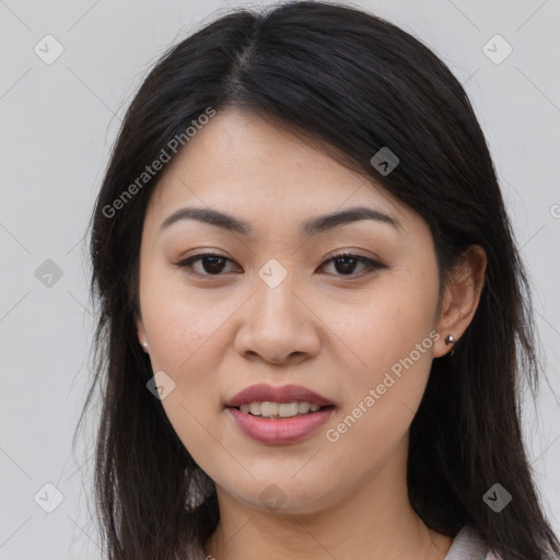 Joyful asian young-adult female with long  brown hair and brown eyes