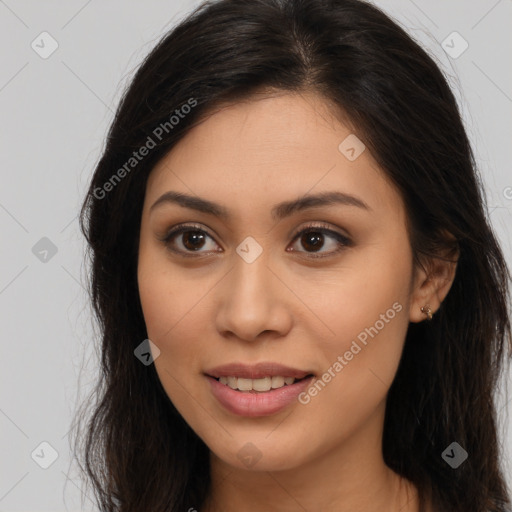 Joyful latino young-adult female with long  brown hair and brown eyes