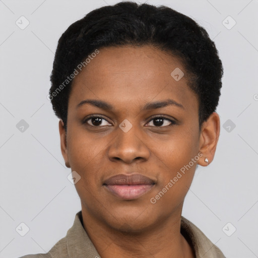 Joyful black young-adult female with short  black hair and brown eyes