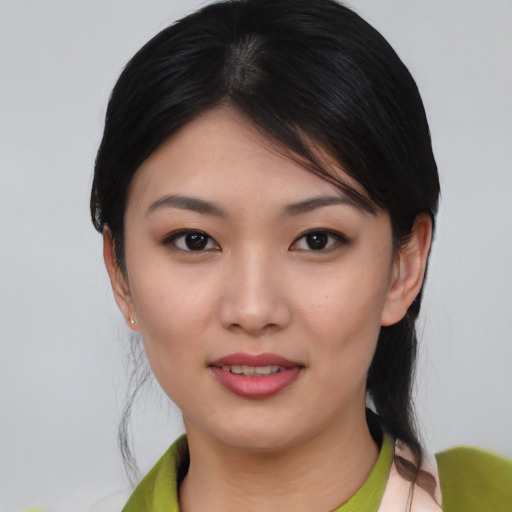 Joyful white young-adult female with medium  black hair and brown eyes