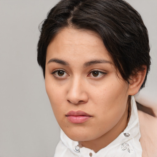 Neutral white young-adult female with short  brown hair and brown eyes