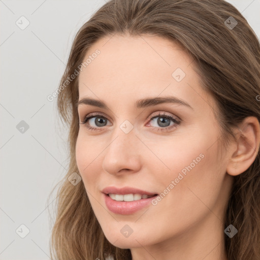 Joyful white young-adult female with long  brown hair and grey eyes