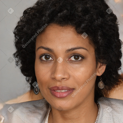 Joyful black young-adult female with long  black hair and brown eyes