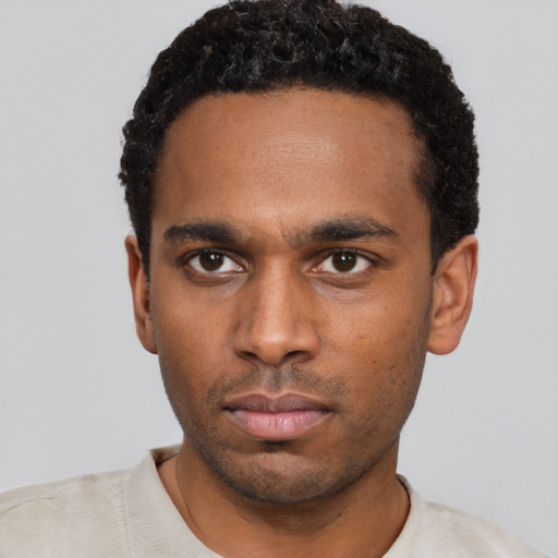 Neutral black young-adult male with short  black hair and brown eyes