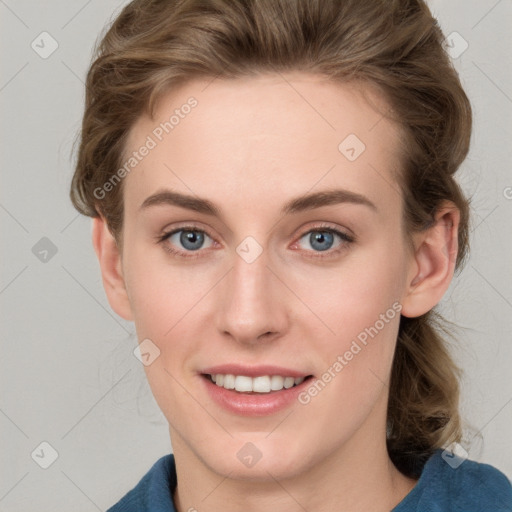 Joyful white young-adult female with medium  brown hair and blue eyes