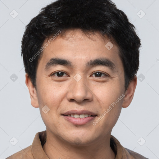 Joyful white young-adult male with short  black hair and brown eyes