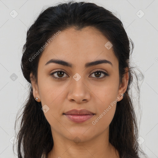 Joyful latino young-adult female with long  brown hair and brown eyes