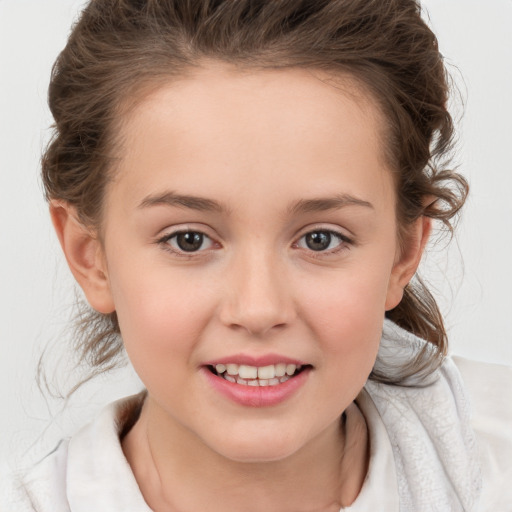 Joyful white child female with medium  brown hair and brown eyes