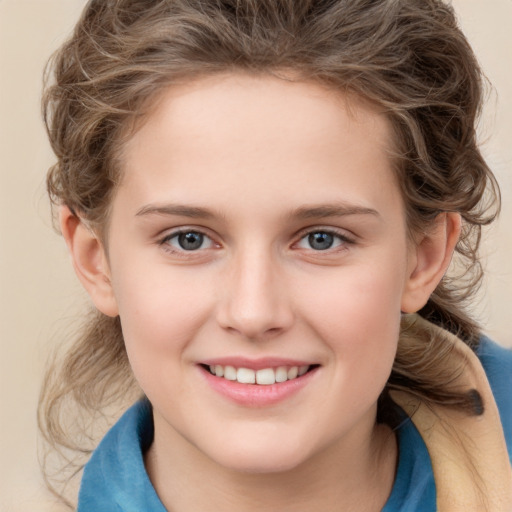 Joyful white child female with medium  brown hair and grey eyes