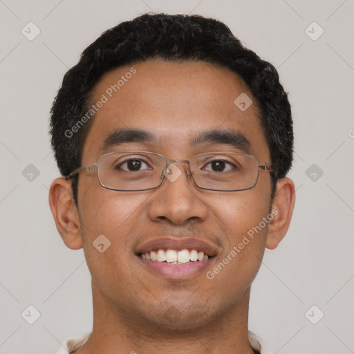 Joyful latino young-adult male with short  black hair and brown eyes