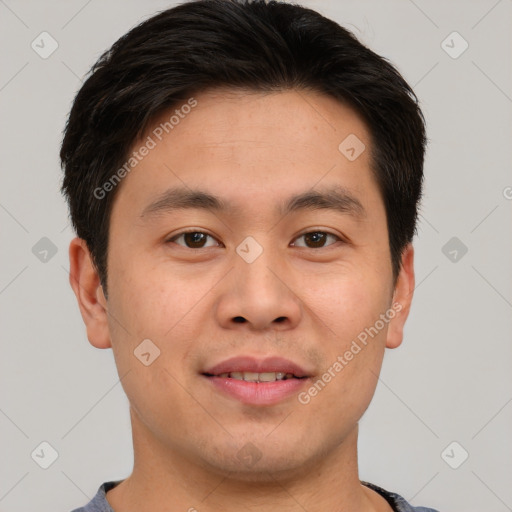 Joyful asian young-adult male with short  brown hair and brown eyes