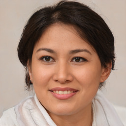 Joyful white young-adult female with medium  brown hair and brown eyes