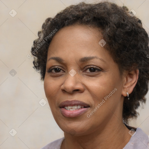 Joyful black adult female with medium  brown hair and brown eyes