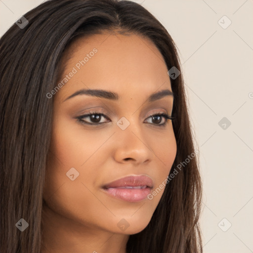 Joyful latino young-adult female with long  brown hair and brown eyes