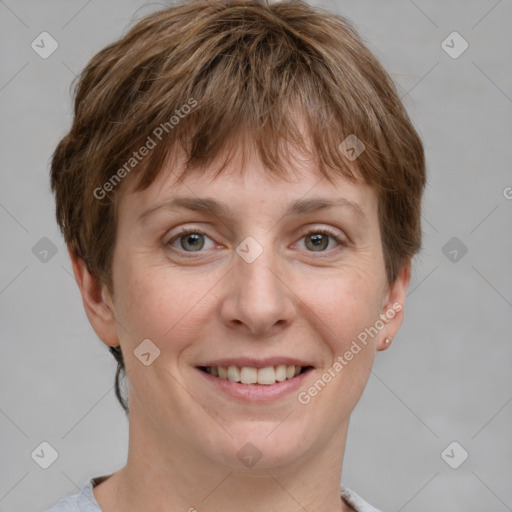 Joyful white young-adult female with short  brown hair and grey eyes