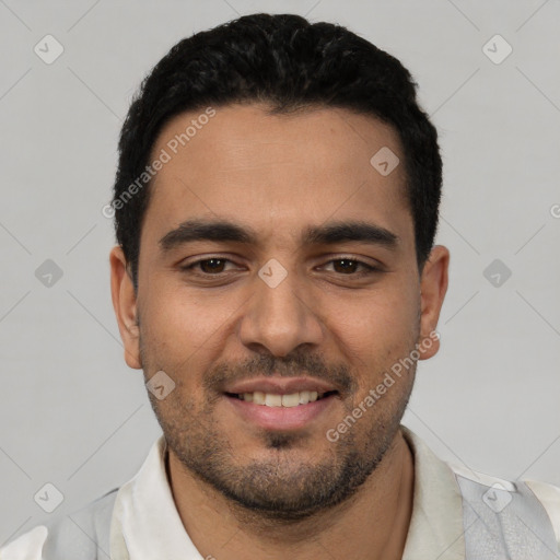 Joyful white young-adult male with short  black hair and brown eyes