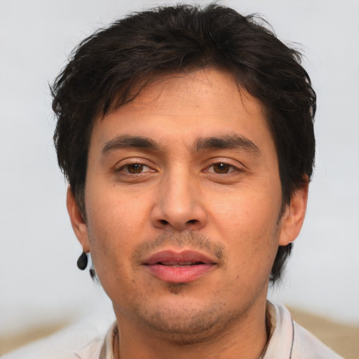 Joyful white adult male with short  brown hair and brown eyes